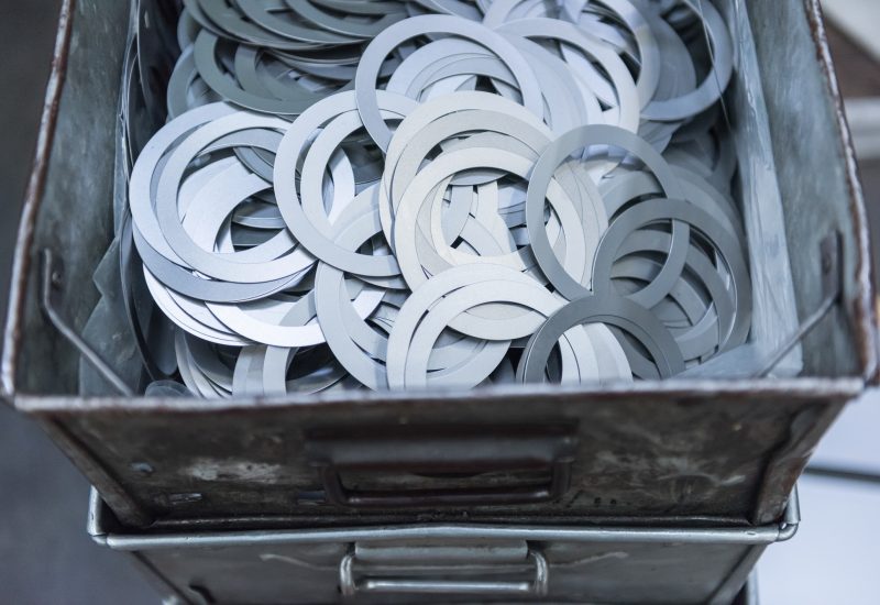 Cut metal parts in engineering factory, close up